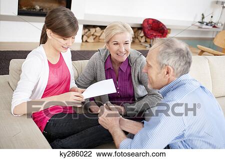 Girl sitting with her grandparents View Large Photo Image Stock Image - Girl sitting with her grandparents. Fotosearch