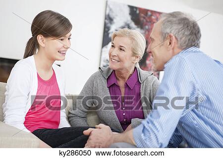 Girl sitting with her grandparents View Large Photo Image Stock Image - Girl sitting with her grandparents. Fotosearch