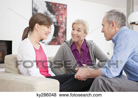 Girl sitting with her grandparents View Large Photo Image Stock Photo - Girl sitting with her grandparents. Fotosearch