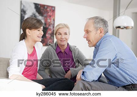 Girl sitting with her grandparents View Large Photo Image Stock Photography - Girl sitting with her grandparents. Fotosearch