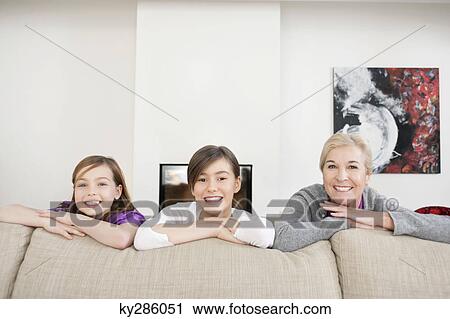 Portrait of a woman smiling with her granddaughters View Large Photo Image Stock Image - Portrait of a woman smiling with her granddaughters. Fotosearch