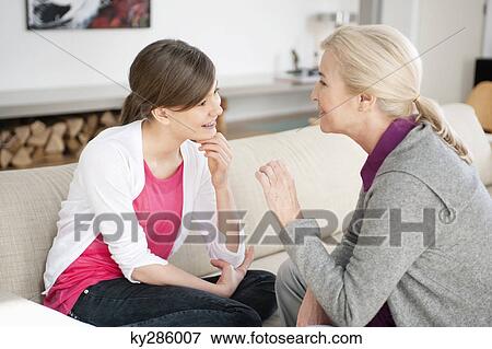 Woman talking with her granddaughter View Large Photo Image Stock Photo - Woman talking with her granddaughter. Fotosearch