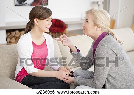 Woman talking with her granddaughter View Large Photo Image Stock Photograph - Woman talking with her granddaughter. Fotosearch