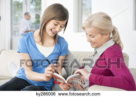 Woman teaching her granddaughter View Large Photo Image Stock Photograph - Woman teaching her granddaughter. Fotosearch