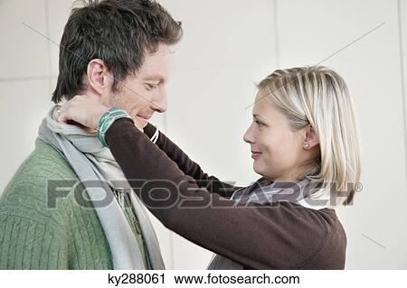 Stock Image - Close-up of a couple smiling. Fotosearch
