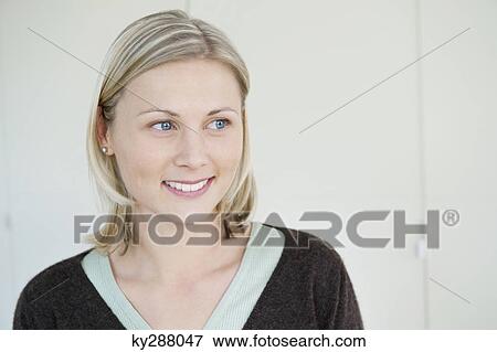 Close-up of a woman smiling View Large Photo Image Stock Photo - Close-up of a woman smiling. Fotosearch