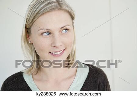 Close-up of a woman smiling View Large Photo Image Stock Photograph - Close-up of a woman smiling. Fotosearch