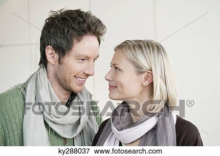Couple smiling at each other View Large Photo Image Stock Photo - Couple smiling at each other. Fotosearch
