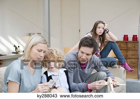Stock Image - Family in a living room. Fotosearch