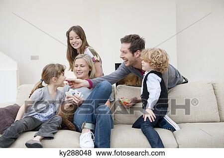 Family in a living room View Large Photo Image Stock Photo - Family in a living room. Fotosearch