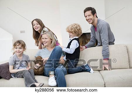 Family in a living room View Large Photo Image Stock Photograph - Family in a living room. Fotosearch