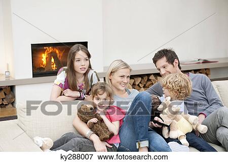 Family watching television View Large Photo Image Stock Photo - Family watching television. Fotosearch