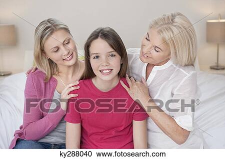 Portrait of a girl sitting with her mother and grandmother View Large Photo Image Stock Image - Portrait of a girl sitting with her mother and grandmother. Fotosearch