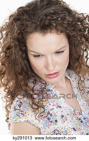 Close-up of a woman looking serious View Large Photo Image Stock Image - Close-up of a woman looking serious. Fotosearch