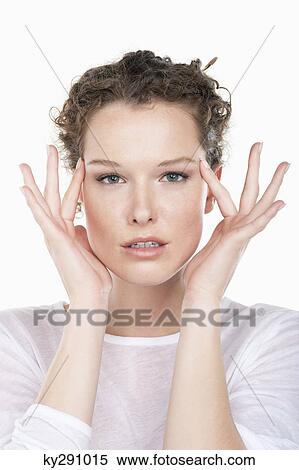 Portrait of a woman rubbing temples View Large Photo Image Stock Photography - Portrait of a woman rubbing temples. Fotosearch