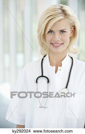 Portrait of a female doctor smiling View Large Photo Image Picture - Portrait of a female doctor smiling. Fotosearch