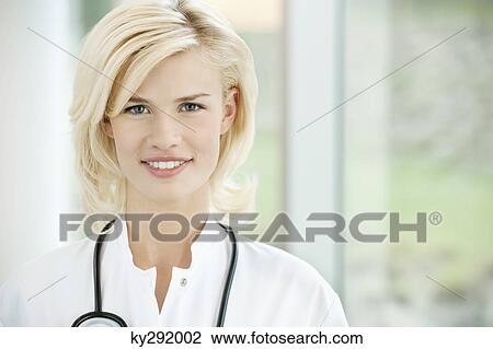 Portrait of a female doctor smiling View Large Photo Image Stock Image - Portrait of a female doctor smiling. Fotosearch