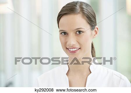 Portrait of a female doctor smiling View Large Photo Image Stock Photo - Portrait of a female doctor smiling. Fotosearch