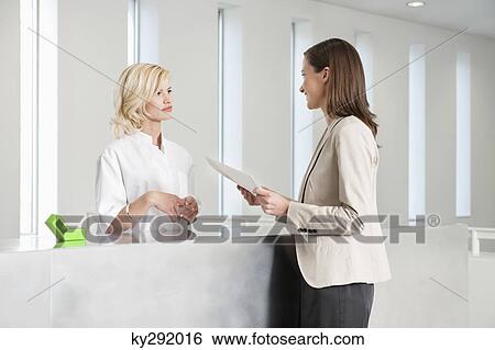 Woman holding a medical report View Large Photo Image Stock Photograph - Woman holding a medical report. Fotosearch