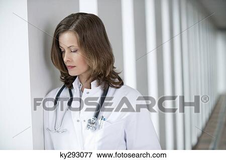 Stock Photo - Female doctor looking upset. Fotosearch