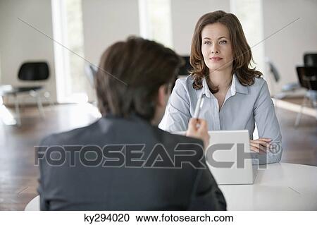 Businesswoman discussing with an advisor View Large Photo Image Stock Image - Businesswoman discussing with an advisor. Fotosearch