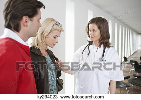 Female doctor consoling a patient View Large Photo Image Stock Image - Female doctor consoling a patient. Fotosearch