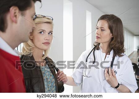 Female doctor consoling a patient View Large Photo Image Stock Photo - Female doctor consoling a patient. Fotosearch