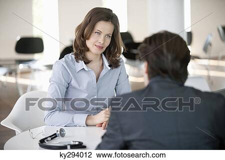 Woman discussing with a man View Large Photo Image Stock Image - Woman discussing with a man. Fotosearch