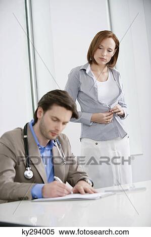 Woman getting dressed after treatment View Large Photo Image Stock Photography - Woman getting dressed after treatment. Fotosearch