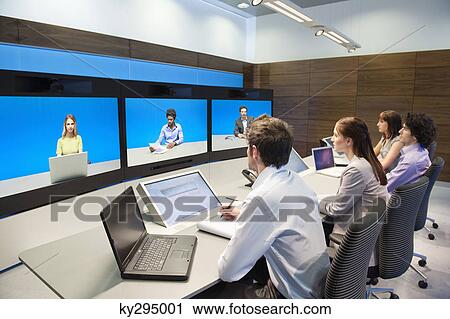 Business executives working in a control room View Large Photo Image Stock Image - Business executives working in a control room. Fotosearch