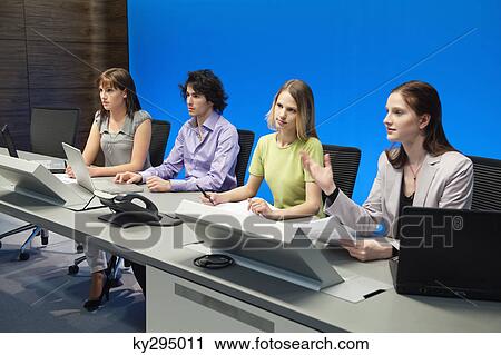Business executives working in a control room View Large Photo Image Stock Image - Business executives working in a control room. Fotosearch