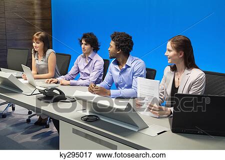 Business executives working in a control room View Large Photo Image Stock Photo - Business executives working in a control room. Fotosearch