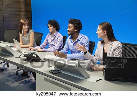 Business executives working in a control room View Large Photo Image Stock Photo - Business executives working in a control room. Fotosearch