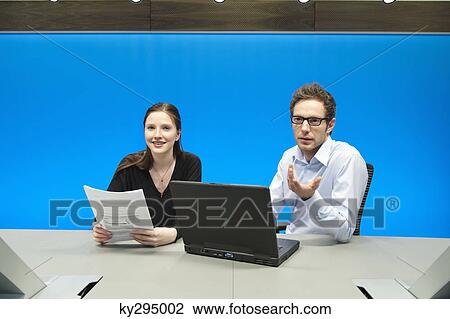 Business executives working on a laptop in a conference room View Large Photo Image Stock Image - Business executives working on a laptop in a conference room. Fotosearch