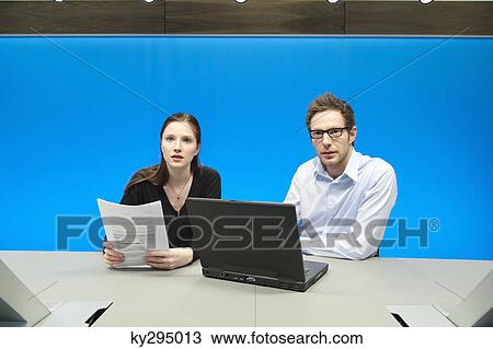 Business executives working on a laptop in a conference room View Large Photo Image Stock Image - Business executives working on a laptop in a conference room. Fotosearch