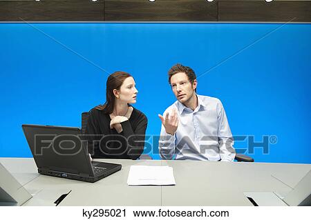 Business executives working on a laptop in a conference room View Large Photo Image Stock Image - Business executives working on a laptop in a conference room. Fotosearch