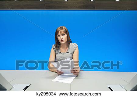 Businesswoman doing paperwork in a conference room View Large Photo Image Picture - Businesswoman doing paperwork in a conference room. Fotosearch