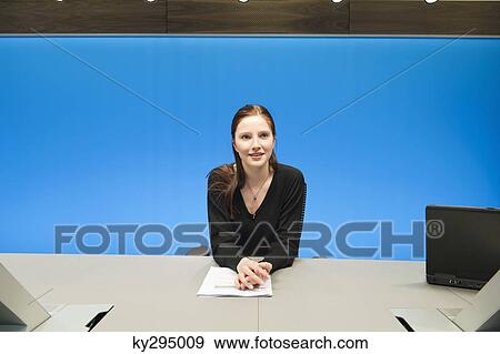 Businesswoman doing paperwork in a conference room View Large Photo Image Stock Photo - Businesswoman doing paperwork in a conference room. Fotosearch