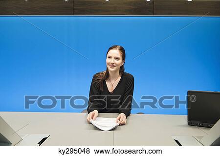 Businesswoman doing paperwork in a conference room View Large Photo Image Stock Photo - Businesswoman doing paperwork in a conference room. Fotosearch