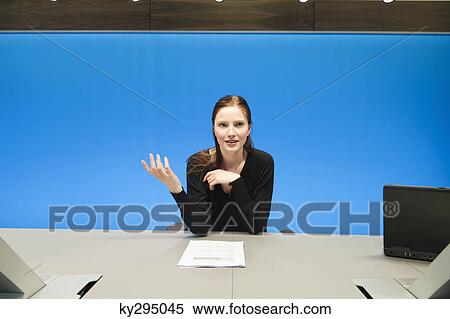 Businesswoman doing paperwork in a conference room View Large Photo Image Stock Photography - Businesswoman doing paperwork in a conference room. Fotosearch