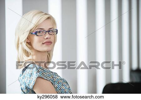 Portrait of a woman wearing eyeglasses View Large Photo Image Stock Photo - Portrait of a woman wearing eyeglasses. Fotosearch