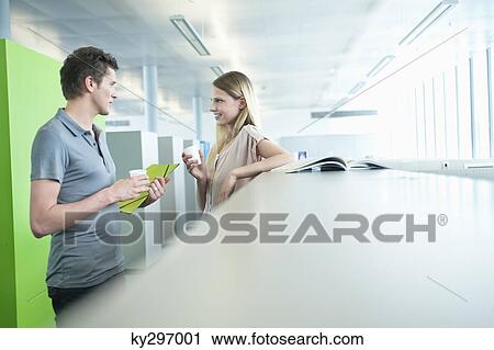 Business executives in an office during a coffee break View Large Photo Image Stock Image - Business executives in an office during a coffee break. Fotosearch