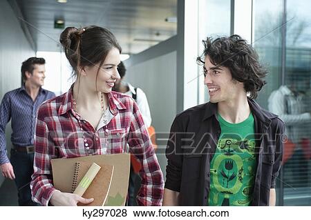 Business executives walking in an office View Large Photo Image Stock Photo - Business executives walking in an office. Fotosearch
