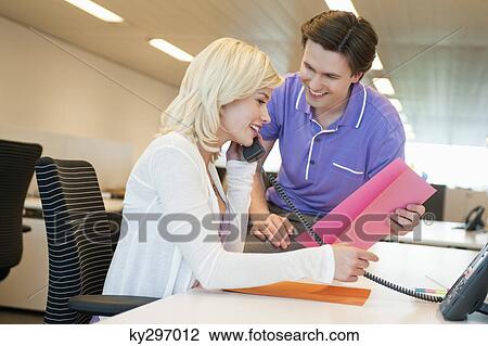 Business executives working in an office View Large Photo Image Stock Image - Business executives working in an office. Fotosearch