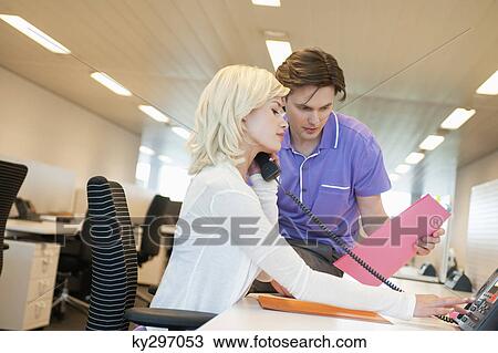 Business executives working in an office View Large Photo Image Stock Image - Business executives working in an office. Fotosearch