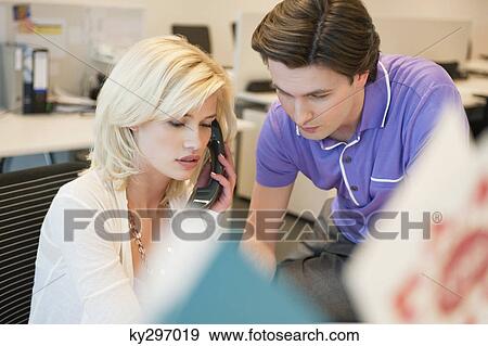Business executives working in an office View Large Photo Image Stock Photo - Business executives working in an office. Fotosearch