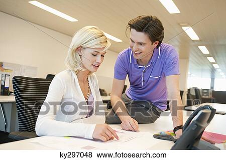Business executives working in an office View Large Photo Image Stock Photo - Business executives working in an office. Fotosearch