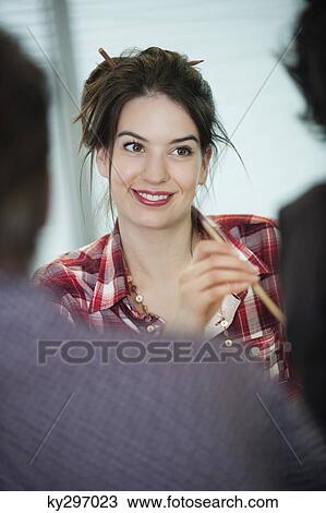 Businesswomen smiling in an office View Large Photo Image Stock Image - Businesswomen smiling in an office. Fotosearch