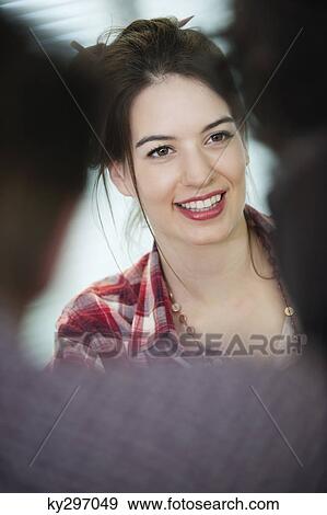 Businesswomen smiling in an office View Large Photo Image Stock Photo - Businesswomen smiling in an office. Fotosearch