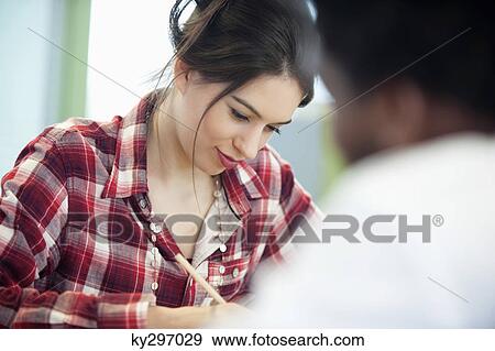 Businesswomen working in an office View Large Photo Image Stock Photo - Businesswomen working in an office. Fotosearch